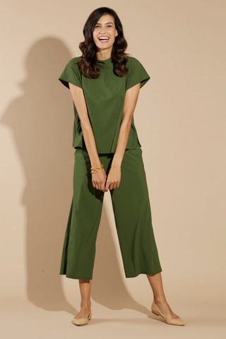 Model wearing the Jude Connally Tillie Top in Loden with a relaxed silhouette and cap sleeves.