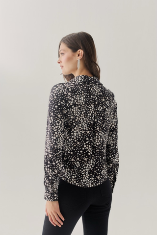 Hutch Atwell Top in Black/Ivory featuring an abstract printed fabric, collared V-neckline, long sleeves, and a relaxed silhouette.