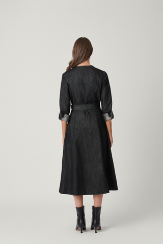 Shoshanna Izzy Dress in jet black featuring a button-front midi silhouette, collared neckline, long sleeves, and waist tie.