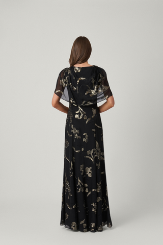 Shoshanna Annalynn Dress in Jet/Gold featuring black lurex chiffon with gold metallic detailing, a boat neckline, and draped cape overlay.