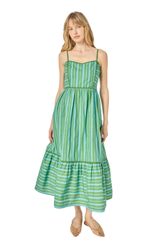 Woman wearing a green and white striped dress on a white background