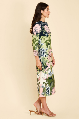Mestiza Consuela Midi Dress in Eventide Gardens featuring a colorful botanical floral print, long sleeves, and a tailored midi silhouette.
