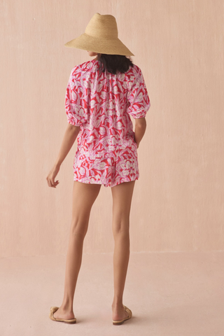 Omika Isla blouse in pink and red Johanna Persimmon floral print with tie neckline and puff sleeves