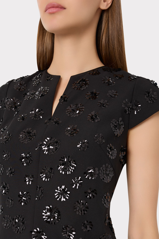 Milly Pat Sequin Mini Dress in Black featuring floral sequin embellishments, a notched V-neckline, short sleeves, and a shift silhouette.