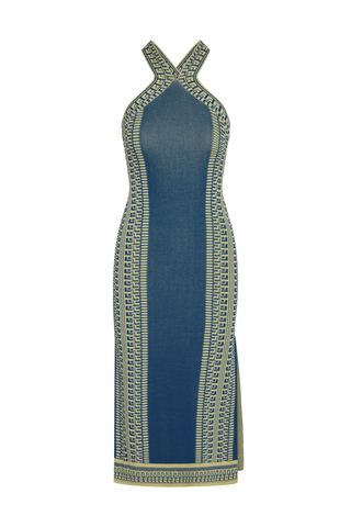 Model wearing the Misa Odessa Dress in Aegean Geometry Blue featuring a crossover halter neckline, geometric knit pattern, side slit, and flattering midi silhouette.