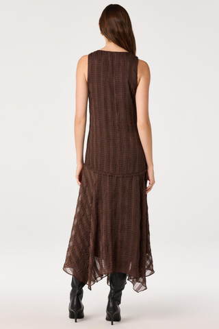 ASTR Halo Dress in Brown Plaid featuring a V-neckline, drop waist, and flowing asymmetric maxi hem.