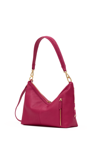 Pink handbag with gold accents on a white background
