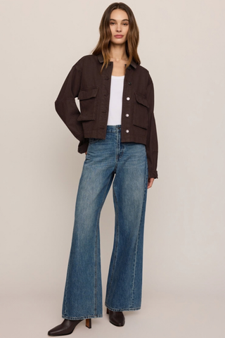 Z Supply Rey Cropped Chore Jacket in Umber featuring a brown cotton body, dark faux leather collar, button front, and utility pockets.