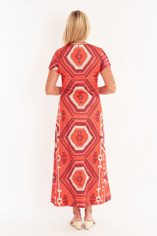 C.K. Bradley Malabar Dress in Kilim Maple red and orange geometric print with short sleeves and a straight maxi silhouette.