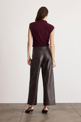Tanya Taylor Adrien Cashmere Turtleneck in Blackberry featuring a fitted sleeveless-style silhouette with cap sleeves and a refined mock neckline.