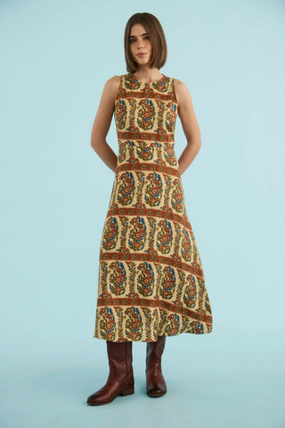 Sleeveless printed linen maxi dress with fitted bodice and full skirt.