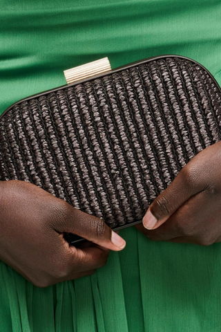 Rue Aveline Alix chocolate evening bag with woven texture, structured silhouette, and gold chain strap