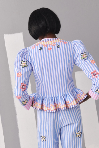 Celia B Avra Jacket in Multi featuring blue and white stripes, colorful embroidered floral details, puff sleeves, and ruffle hem styling