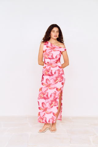 Model wearing MINKPINK Bianca Mesh Midi Dress in Pink Floral featuring an asymmetrical off-the-shoulder neckline, ruched mesh fabrication, and side slit detail