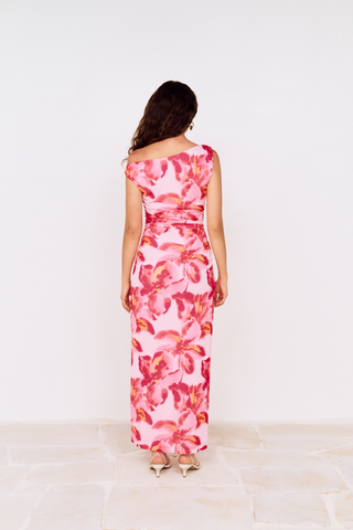Model wearing MINKPINK Bianca Mesh Midi Dress in Pink Floral featuring an asymmetrical off-the-shoulder neckline, ruched mesh fabrication, and side slit detail