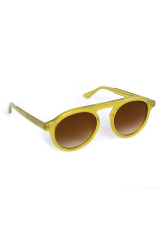 KREWE Cameron Sunglasses in Chartreuse featuring a rounded aviator silhouette, connected brow bar, translucent acetate frame, and brown gradient lenses