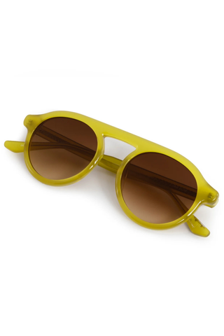 KREWE Cameron Sunglasses in Chartreuse featuring a rounded aviator silhouette, connected brow bar, translucent acetate frame, and brown gradient lenses