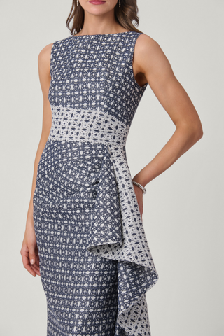 Shoshanna Catherine Dress in Silver and Indigo with sleeveless fitted bodice, patterned fabric, long skirt, and cascading side ruffle.