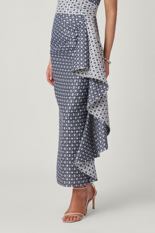 Shoshanna Catherine Dress in Silver and Indigo with sleeveless fitted bodice, patterned fabric, long skirt, and cascading side ruffle.