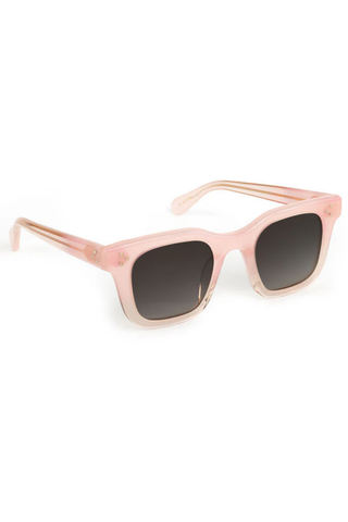 Pink sunglasses with dark lenses on a white background
