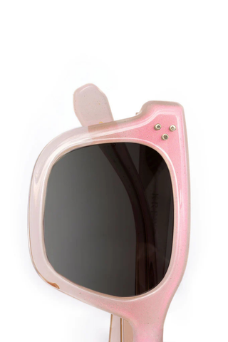 Pink sunglasses with a unique design on a white background