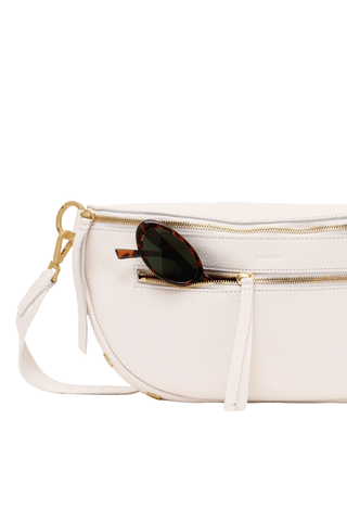 White pebbled leather crossbody belt bag with gold hardware by Hammitt