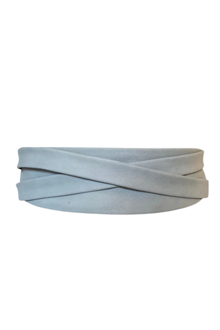 ADA Collection cloud blue wrap leather belt tied at the waist over white tiered dress