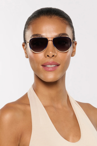Krewe Coleman Sunglasses in Matte Indigo Fade featuring gold-plated aviator hardware, grey gradient lenses, and modern side shield detailing