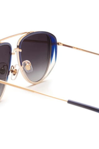 Krewe Coleman Sunglasses in Matte Indigo Fade featuring gold-plated aviator hardware, grey gradient lenses, and modern side shield detailing