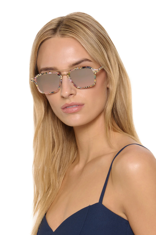 Krewe Colton Sunglasses in Pink Poppy featuring marbled acetate frames, mirrored amber gradient lenses, and gold-plated aviator detailing