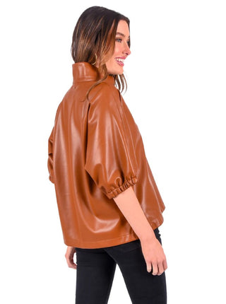 Emily McCarthy Poppy Top in Luggage Vegan Leather featuring a relaxed silhouette, stand collar, and short dolman sleeves.