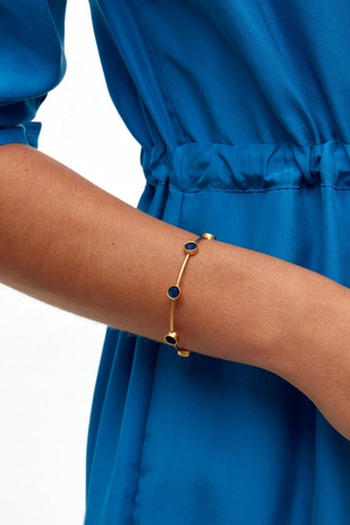 Brackish Deci Multi-Bezel cuff bracelet with blue peacock feather bezels and 18k gold plated finish
