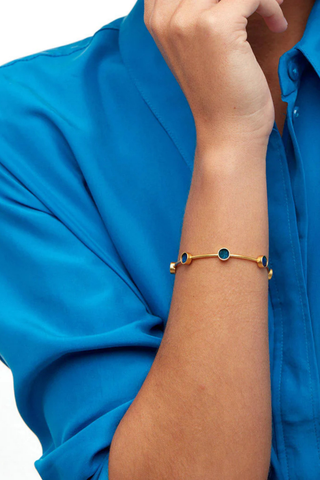 Brackish Deci Multi-Bezel cuff bracelet with blue peacock feather bezels and 18k gold plated finish