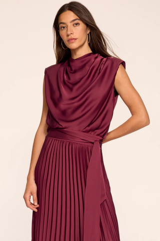 Ramy Brook Farah Dress in Cranberry, a sleeveless cranberry satin maxi dress with a draped cowl neckline, sash waist, and pleated skirt.