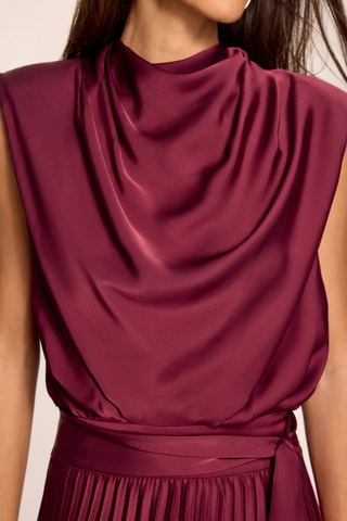 Ramy Brook Farah Dress in Cranberry, a sleeveless cranberry satin maxi dress with a draped cowl neckline, sash waist, and pleated skirt.