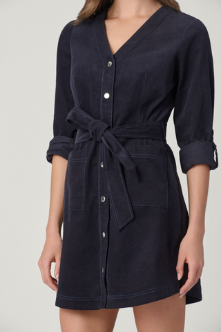 Shoshanna Hamlin Dress in Ink featuring a collared button front, three-quarter sleeves, tie waist, contrast stitching, and mini silhouette.