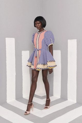 Celia B Kaen Dress in Multi featuring mixed stripe prints, puff sleeves, front zipper detail, and dramatic flared mini silhouette
