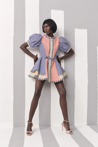 Celia B Kaen Dress in Multi featuring mixed stripe prints, puff sleeves, front zipper detail, and dramatic flared mini silhouette
