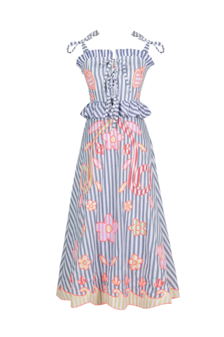 Celia B Kailen Dress in Multi featuring blue striped cotton fabric, colorful floral embroidery, ruffle trim, and tie shoulder straps