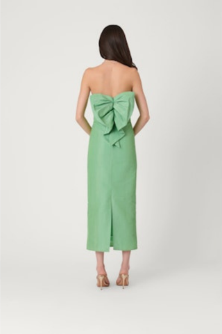 Strapless sage green midi dress with smocked ruched bodice and slim column silhouette, shown on model against white background.