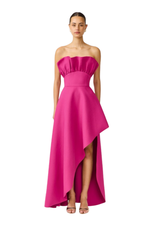 Elliatt Liora Asymmetric Gown in Pink Orchid featuring a strapless neckline, asymmetric draped overlay, and front slit.