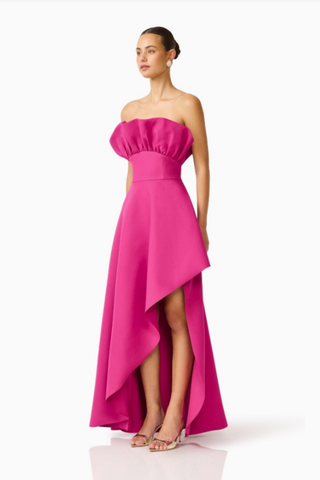 Elliatt Liora Asymmetric Gown in Pink Orchid featuring a strapless neckline, asymmetric draped overlay, and front slit.
