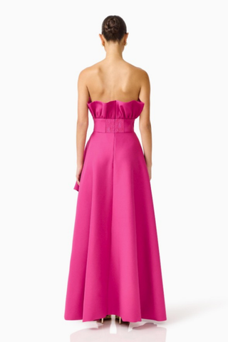 Elliatt Liora Asymmetric Gown in Pink Orchid featuring a strapless neckline, asymmetric draped overlay, and front slit.