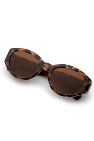 Krewe Lucy Sunglasses in Venezia featuring glossy tortoise acetate frames with amber lenses and a wraparound silhouette