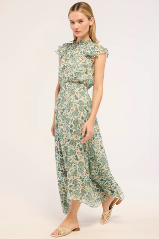 MISA Mariposa Dress in Azure Flora featuring blue floral chiffon, ruffle sleeves, smocked waist, and flowing handkerchief hem maxi dress