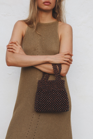 Bembien Maris Bag in brown beaded top handle bag made from polished maple wood beads with structured silhouette