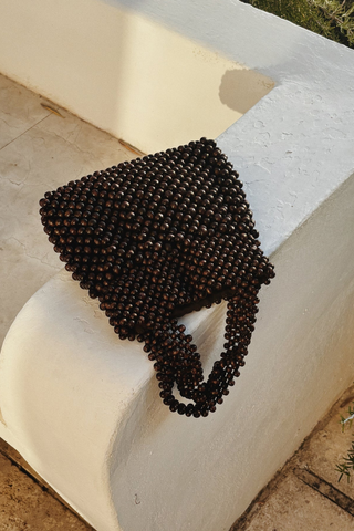 Bembien Maris Bag in brown beaded top handle bag made from polished maple wood beads with structured silhouette