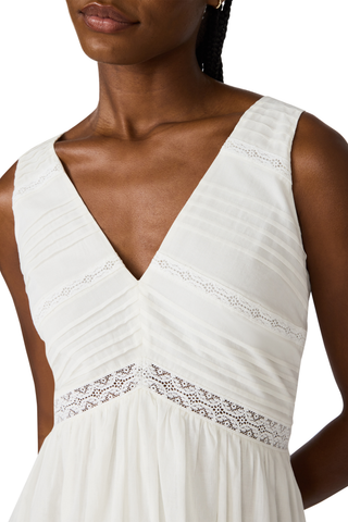 White cotton high-low maxi dress with lace trim, pintuck detailing, and open tie back by Steve Madden