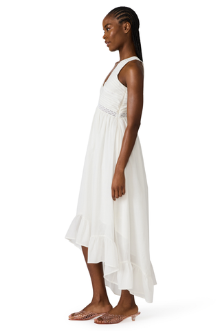 White cotton high-low maxi dress with lace trim, pintuck detailing, and open tie back by Steve Madden