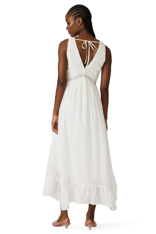 White cotton high-low maxi dress with lace trim, pintuck detailing, and open tie back by Steve Madden